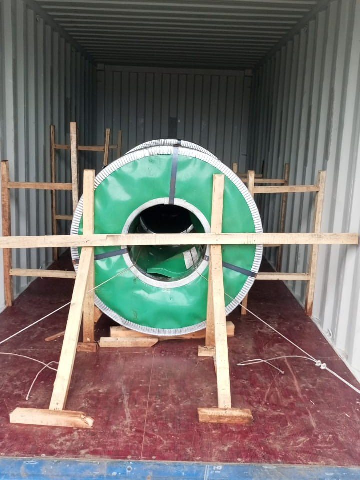The timber frame and coil tied down with wire to the container floor